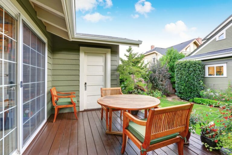 Back deck guest house with wooden table set