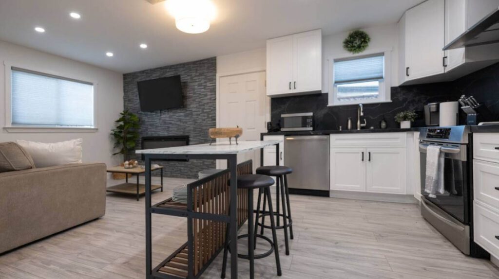 Kitchen with small eating area and living room